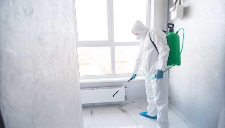 A certified mold inspector using specialized equipment to identify and locate mold growth in a residential property in Lauderhill